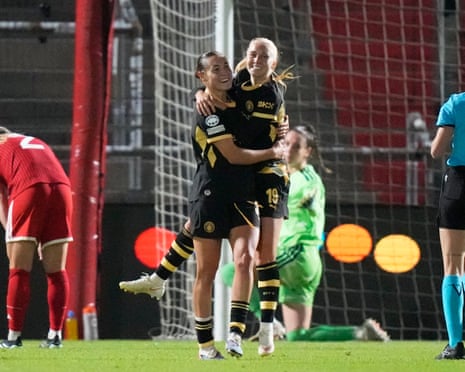 Manchester City's Carlotta Wamser is embraced by Laura Blindkilde Brown after her late equaliser for Manchester City.