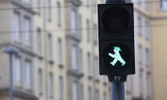 Green Ampelmann pedestrian signal on a street in the former East Berlin in Germany<br>2BWACYX Green Ampelmann pedestrian signal on a street in the former East Berlin in Germany