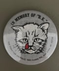 Gray button with cat face with tear coming out of eye, that says In Memory of BK.