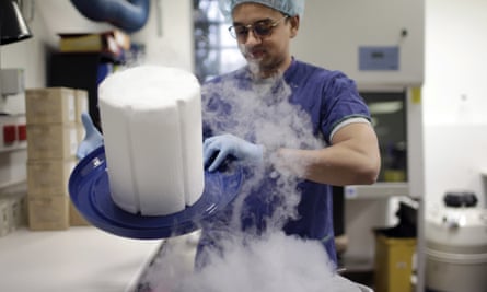 Scientist Fabrice De Bond opens the lid of a cryotank containing donor sperm samples in a lab in Melbourne.
