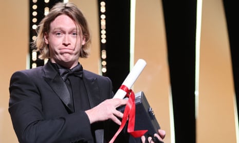 US actor Caleb Landry Jones poses on stage at the Cannes film festival after winning the best actor prize for playing Port Arthur mass murderer Martin Bryant in the film Nitram.