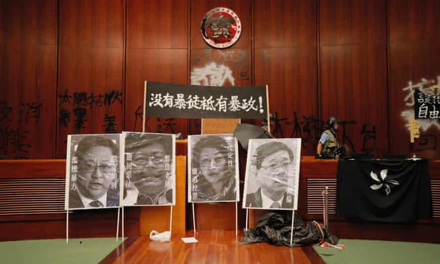 Defaced portraits of Hong Kong officials in the legislative council building