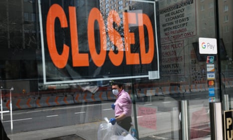A closed sign in the window of a business in New York City
