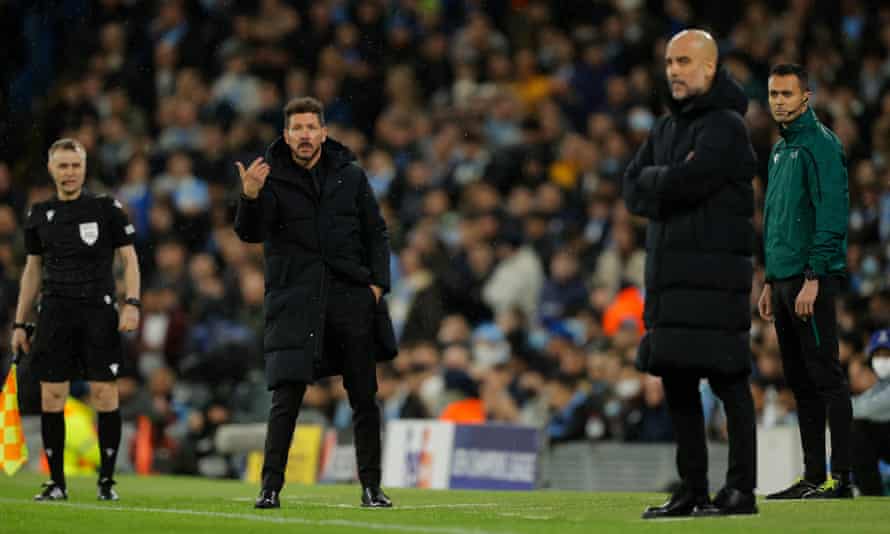 Diego Simeone (left) and Pep Guardiola jostle for room on the touchline.
