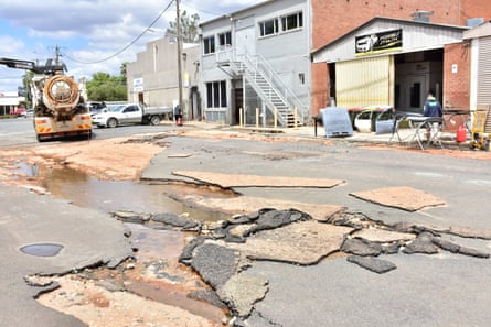 A road is damaged after flooding