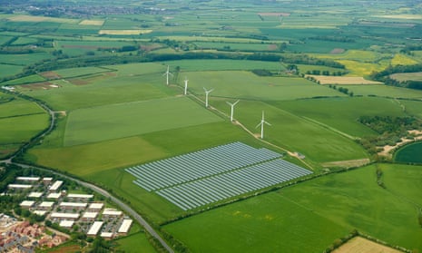 Solar farm adjacent to a wind farm