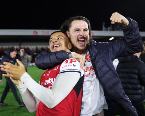 FleetwoodâÂÂs Raffaele Cirino gets gripped by a fan after the win over Arsenal