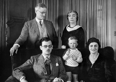 James Joyce pictured with his family in their Paris home. Joyce and his wife are standing. Seated are the author’s son and daughter-in-law, with their child between them.