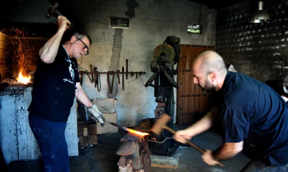 Antonio Arellano hammering steel