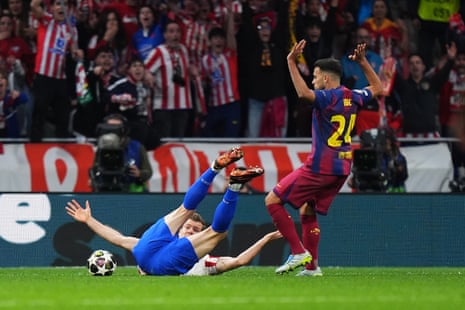 Eric Garcia of Barcelona fouls Alexander Sorloth of Atletico Madrid which results in referee Clement Turpin showing a red card to Garcia.