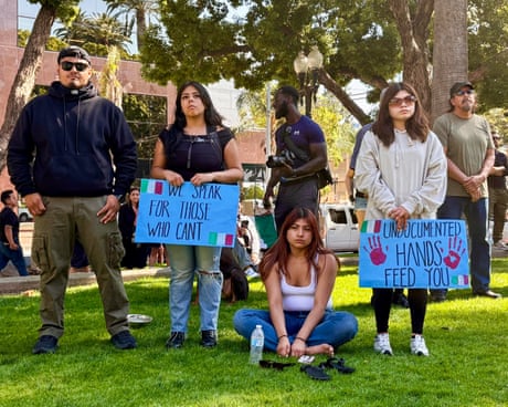 people hold signs that read 'we speak for those who can't' and 'undocumented hands feed you'
