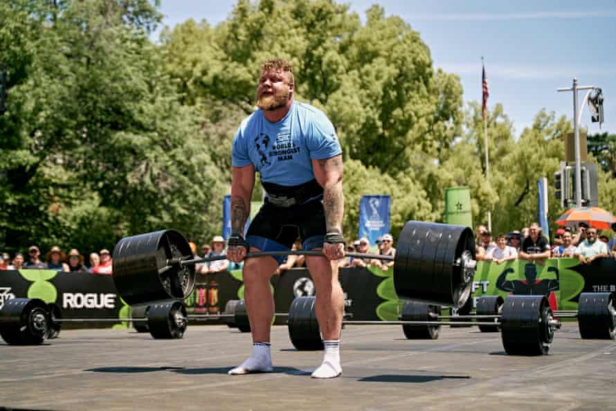 Stoltman strains as he lifts a huge set of weights