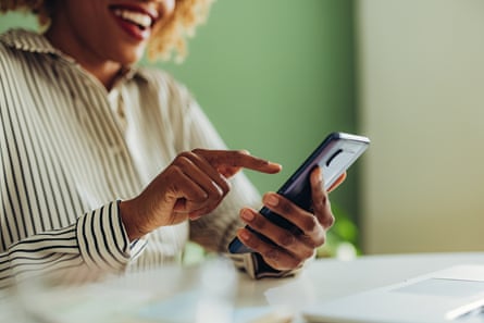 Woman typing text message on her smartphone
