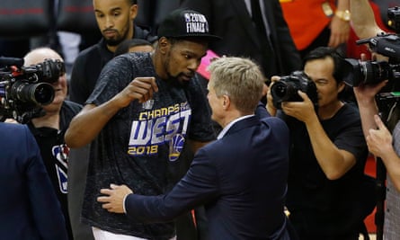 Kerr celebrates with Kevin Durant after the Warriors beat the Rockets in the Western Conference final.