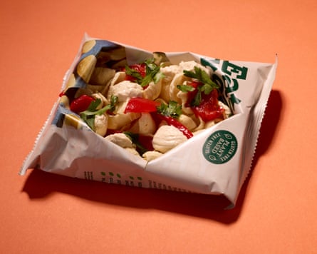 Eat Real lentil crisps with hummus, red pepper and parsley.