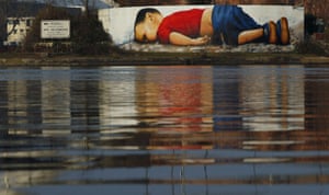 A huge graffiti artwork of Alan Kurdi by German artists Justus Becker and Oguz Sen on the banks of Main river near European Central Bank HQ in Frankfurt.