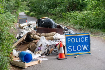 Asbestos and household waste illegally fly-tipped overnight on a country lane in Wexham, Buckinghamshire.