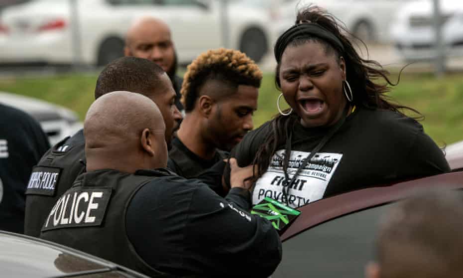Police arrest Ashley Cathey during a protest in front of the Shelby County Criminal Justice Center. Photograph: Brandon Dill for The Guardian