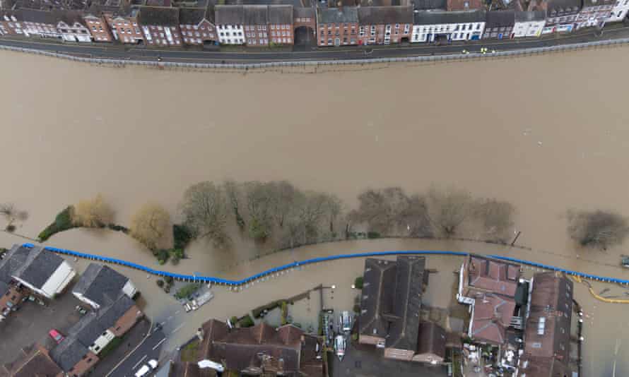 Water begins to spill behind flood defences along the River Severn at Bewdley, Worcestershire, after Storm Franklin.
