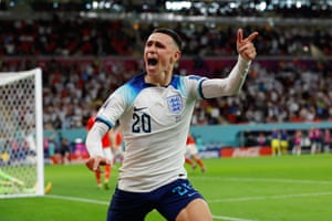 Phil Foden celebrates scoring the second goal against Wales in a 3-0 group stage win.