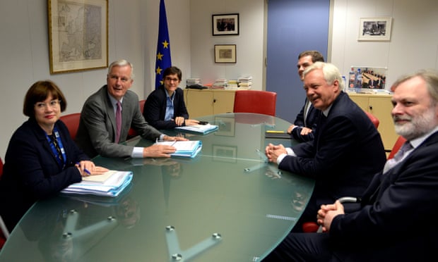 The EU’s Michel Barnier and Britain’s Brexit secretary, David Davis, face each other across the table.