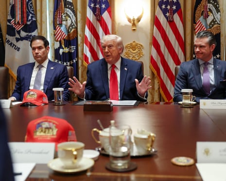 Donald Trump flanked by his secretary of state Marco Rubio and defense secretary Pete Hegseth, in Wednesday’s cabinet meeting.