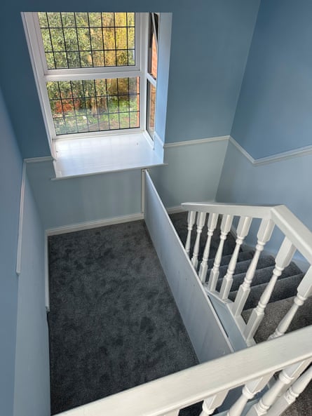 Vestibule space with staircase going down to it.