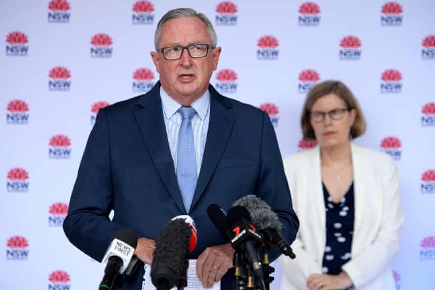 NSW health minister Brad Hazzard addresses media on Wednesday as Dr Kerry Chant stands behind.