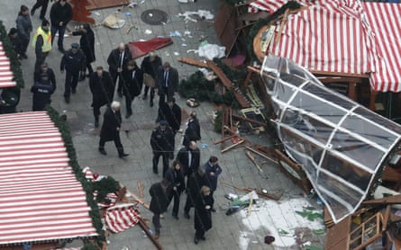 Angela Merkel visits the site of the attack.