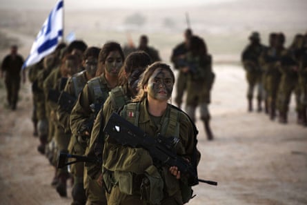 Israeli soldiers of the 33rd Caracal Battalion take part in a graduation march in the northern part of the southern Israeli Negev desert, 13 March 2013.