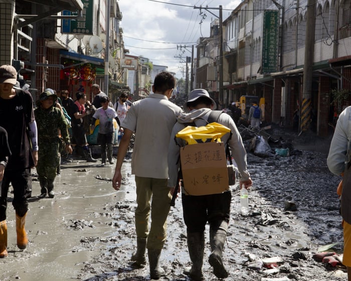 Gym bros, monks, retirees: thousands descend on Taiwan town to clean up after devastating flood