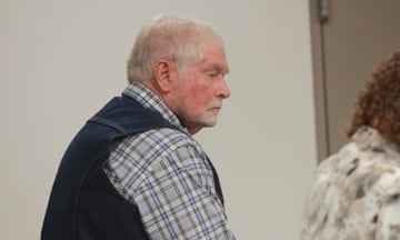 Man in check shirt and vest listens to closing arguments last week