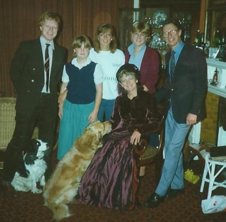 The family pose for a photo