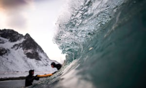 A beginner taking a surfing lesson near Unstad, Norway.