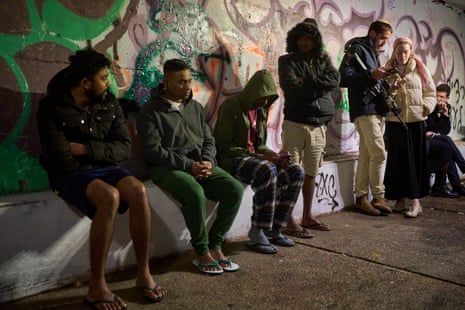 People take shelter in an underground tunnel as air raid sirens signal a warning of incoming Iranian missiles in Jerusalem on Thursday.