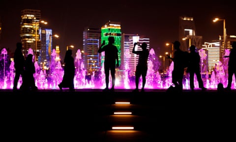 Tourists and locals near the Lusail fountain display near the seafront in Lusail.
