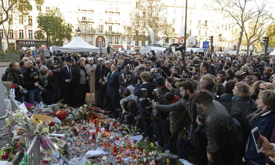 Representatives of the Jewish and Muslim communities join people gathered at the makeshift memorial near the Bataclan concert hall in Paris.