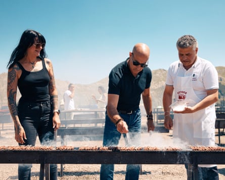 Stanley Tucci in at BBQ joint Ristoro Mucciante and with food and motor journalist Cristina Bachetti (left) and cooks with one of the owners, Rodolfo Mucciante.