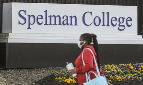 A woman walks outside the Spelman campus after two historically Black colleges in Georgia received bomb threats.