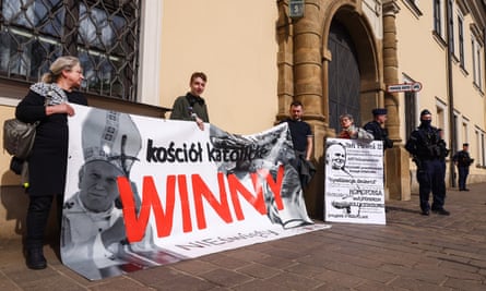 Activists hold a banner reading ‘Catholic Church Guilty’ during a protest in Krakow in March against members of the Catholic hierarchy, including Pope John Paul II, accusing them of covering up sex abuse.