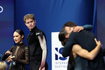Madison Chock and Evan Bates stand after their ice dance competition.