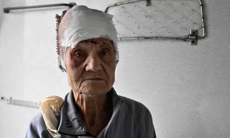 Nina, 90, a patient on a medical evacuation train is seen on its way to the western Ukrainian city of Lviv on 10 April.