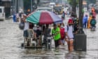 Philippines floods: thousands flee Manila after days of torrential rain