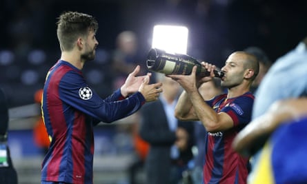 Javier Mascherano celebrates Barcelona’s 2015 Champions League win with Gerard Pique.