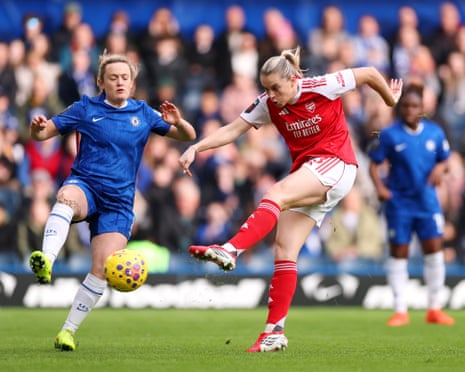 Alessia Russo of Arsenal fires off a shot whilst under pressure from Erin Cuthbert of Chelsea during the opening minutes.