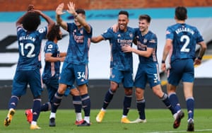 Pierre-Emerick Aubameyang (centre) celebrates with his team mates after scoring Arsenal’s third goal of the game.