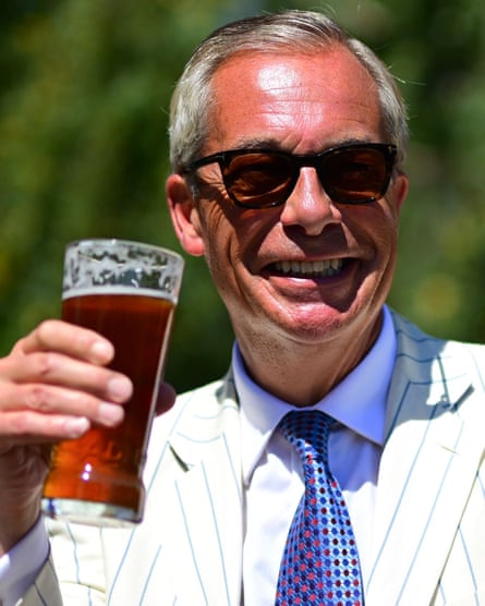 Nigel Farage poses with a pint in a Clacton pub beer garden.