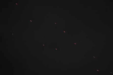 Several flashes of light in the night sky, denoting bullets from Ukrainian anti-aircraft guns