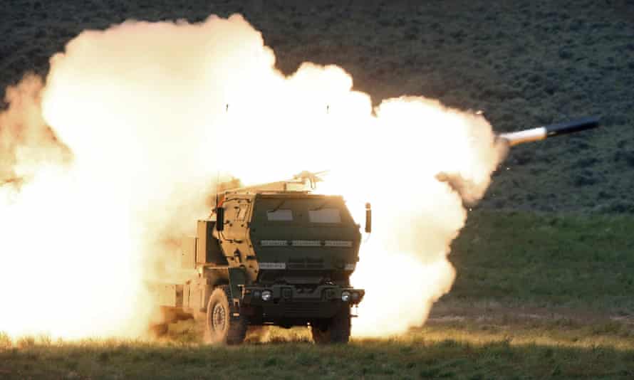 In this May 23, 2011, file photo a launch truck fires the High Mobility Artillery Rocket System (HIMARS) produced by Lockheed Martin during combat training in the high desert of the Yakima Training Center, Wash.