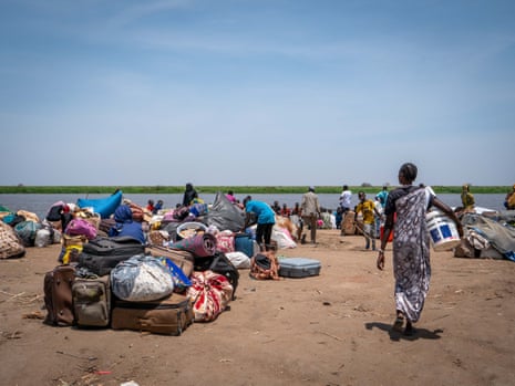 South Sudanese returnees stranded with their luggage at the port of Renk, a month after the war broke out in Khartoum.